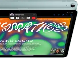 iPad Air, with 12MP Center Stage camera showing a user on FaceTime, in front of another iPad Air model showing the back exterior and camera